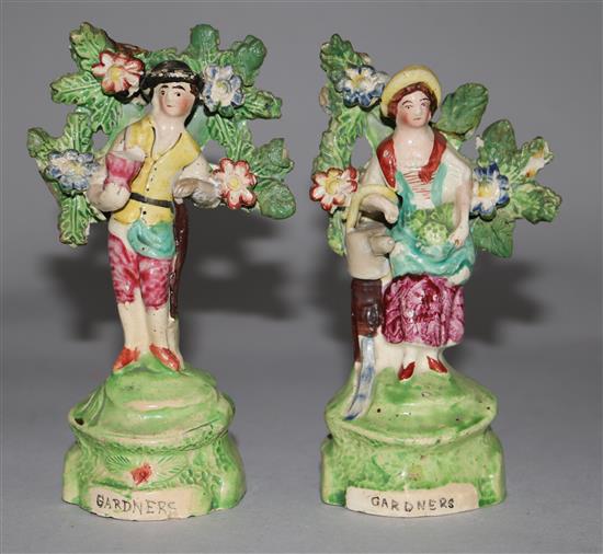 A pair of Staffordshire pottery figures incised Gardeners, c.1830, 5.5in. (damage to bocage)